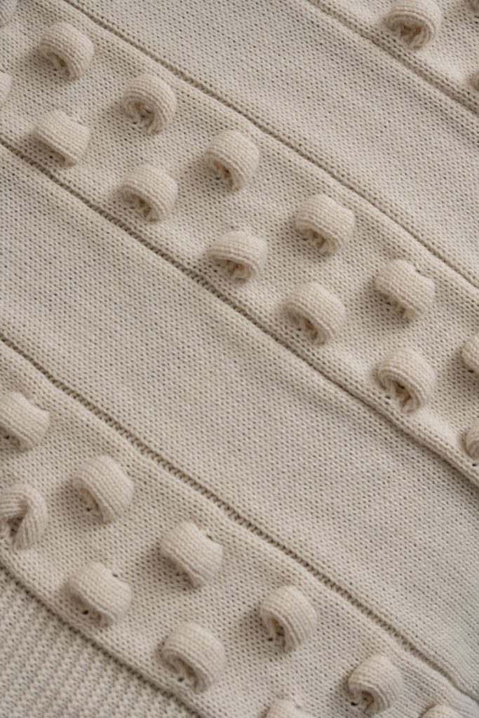 Almofadas e manta em tricô pérola